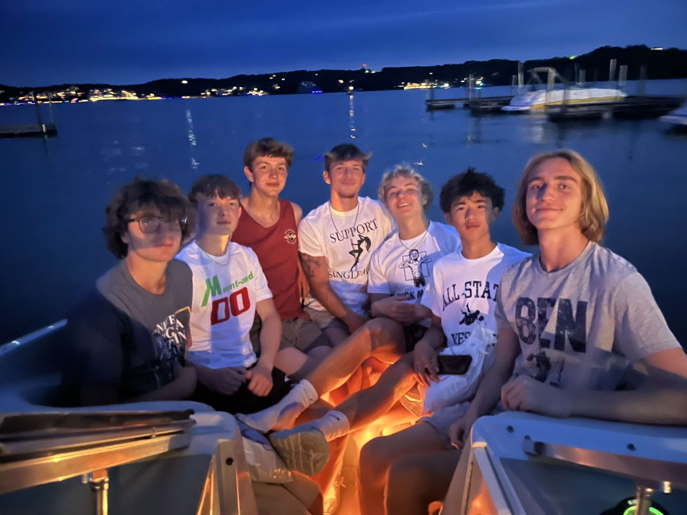 Sam with friends on a boat